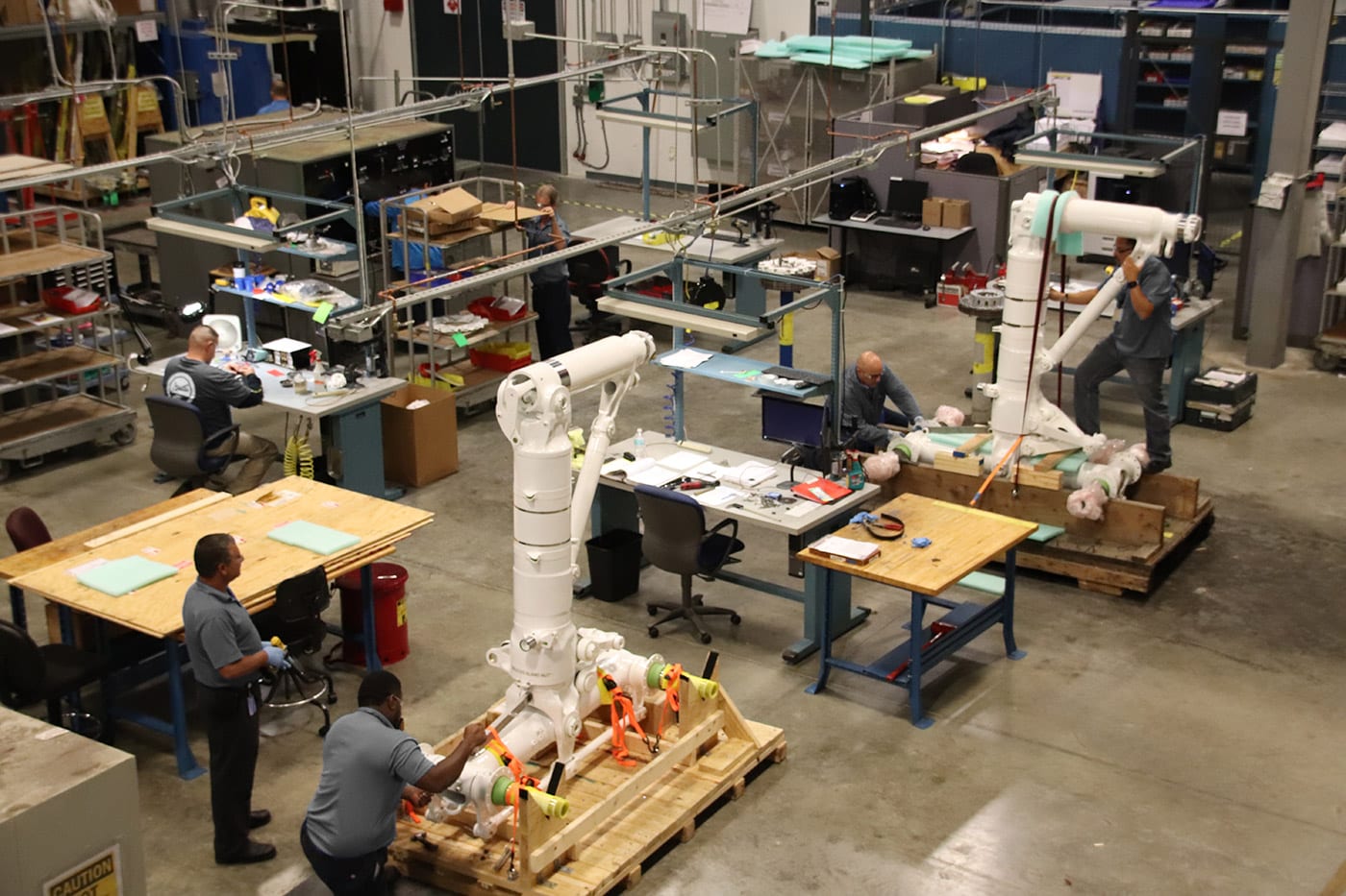 workers delivering MRO services on landing gear